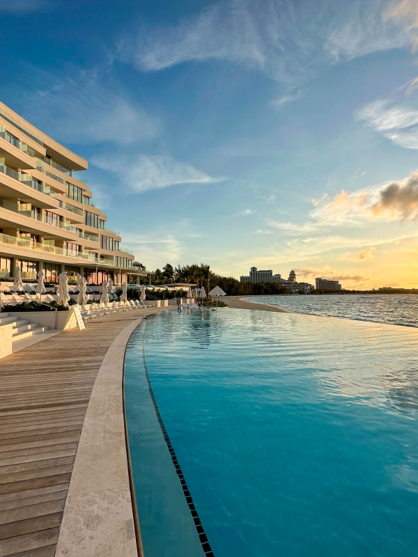 hotel and pool with sunset 